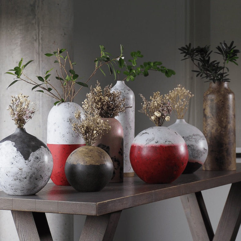 Handicraft sustainable and recycled paper vase from Asia. The home decor vase is made of recycled paper and is sold online on www.qacrafts.com.