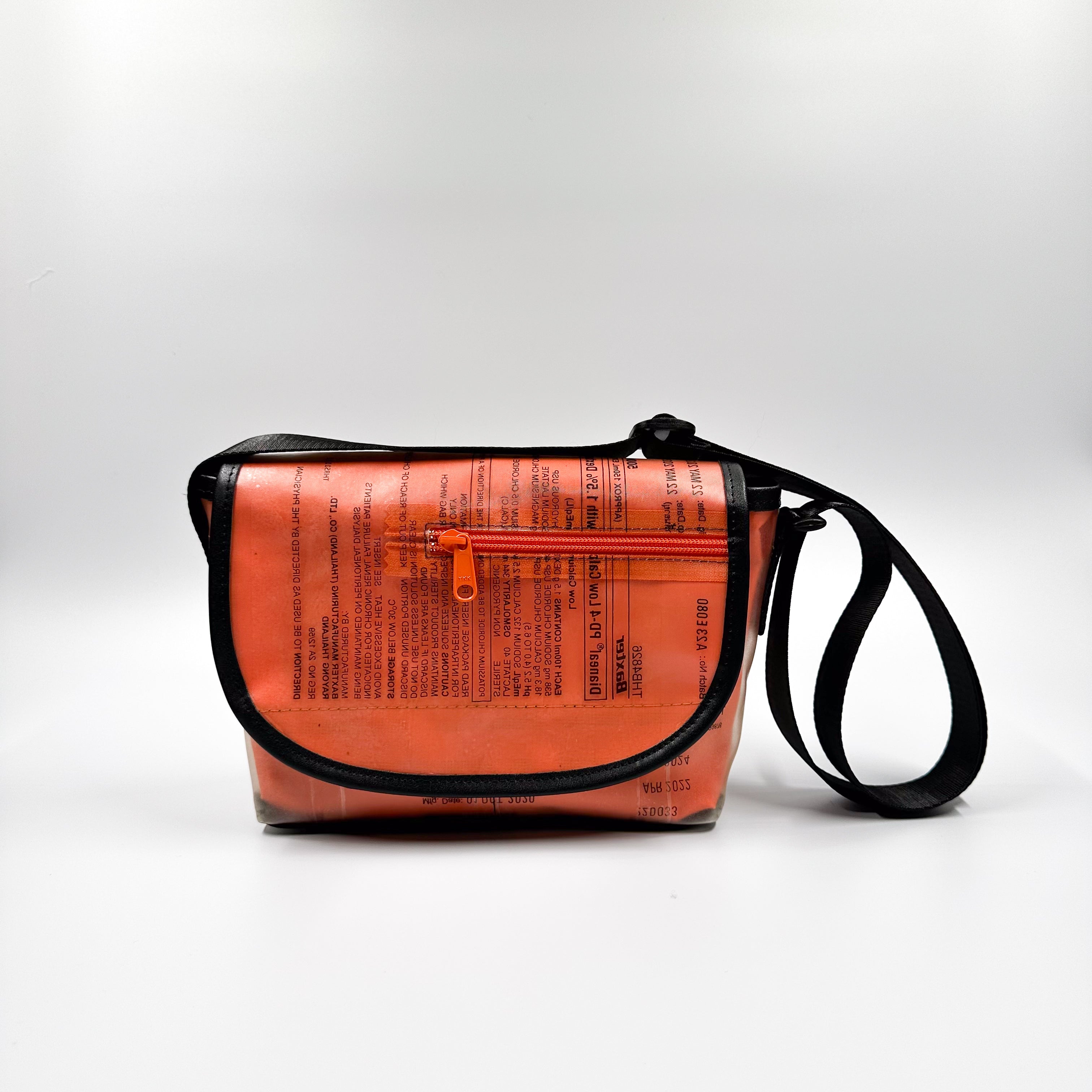 Handicraft sustainable and recycled accessory bag from Asia. The pouch is made of recycled dialysis bag and is sold online on www.qacrafts.com.