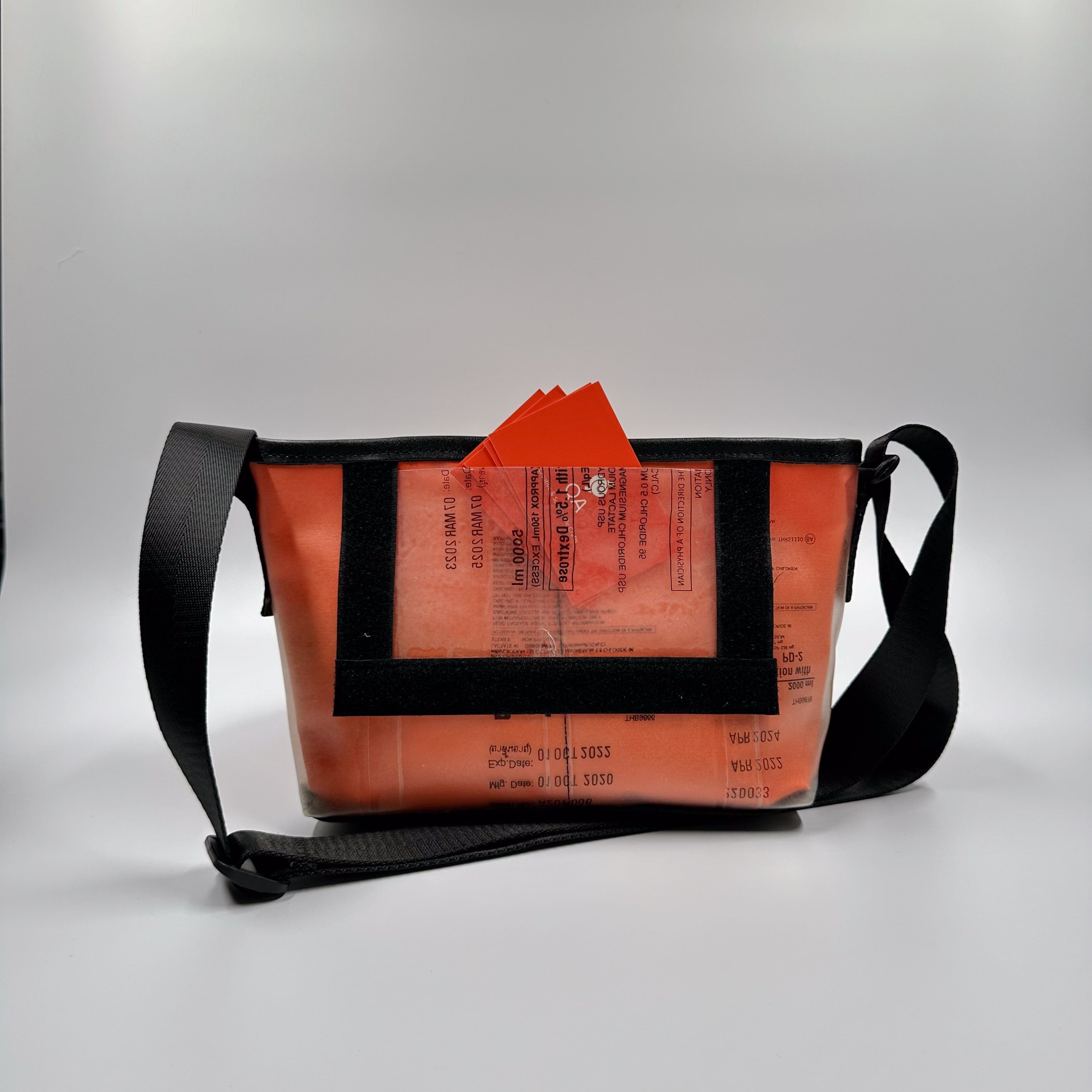 Handicraft sustainable and recycled accessory bag from Asia. The pouch is made of recycled dialysis bag and is sold online on www.qacrafts.com.