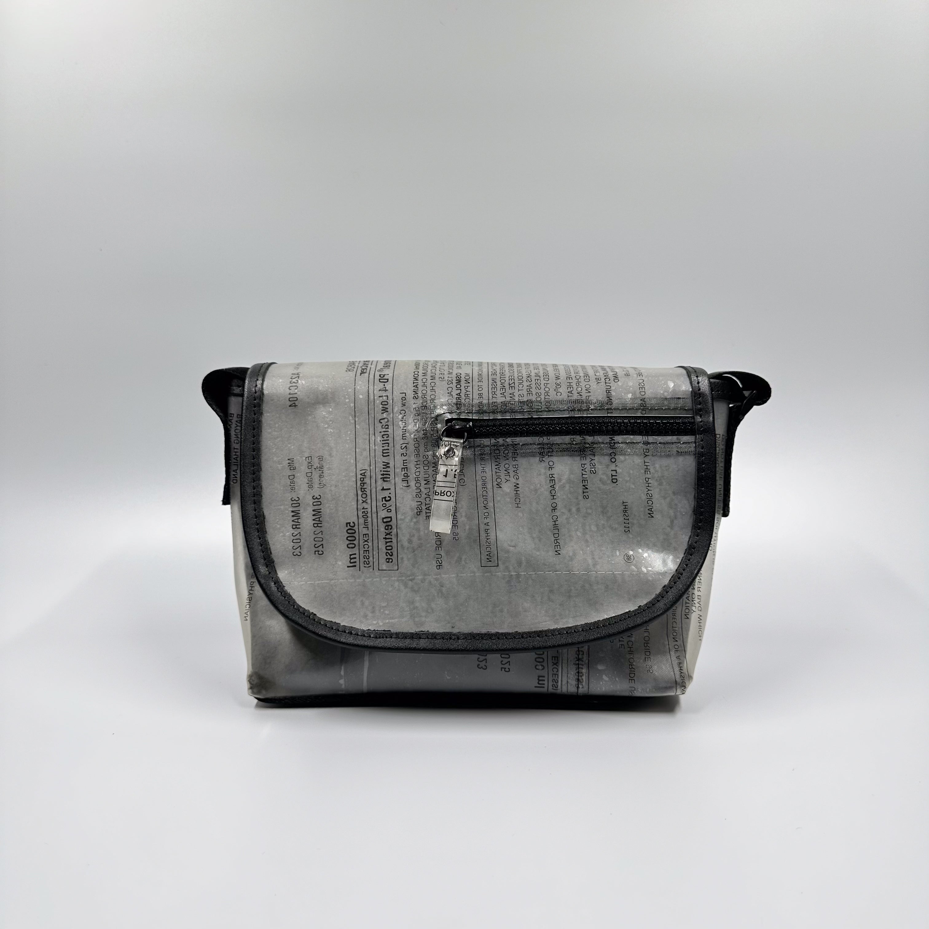 Handicraft sustainable and recycled accessory bag from Asia. The pouch is made of recycled dialysis bag and is sold online on www.qacrafts.com.