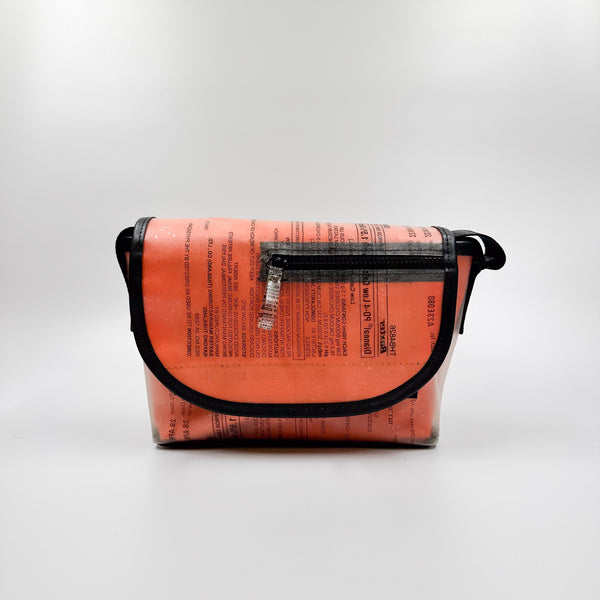 Handicraft sustainable and recycled accessory bag from Asia. The pouch is made of recycled dialysis bag and is sold online on www.qacrafts.com.