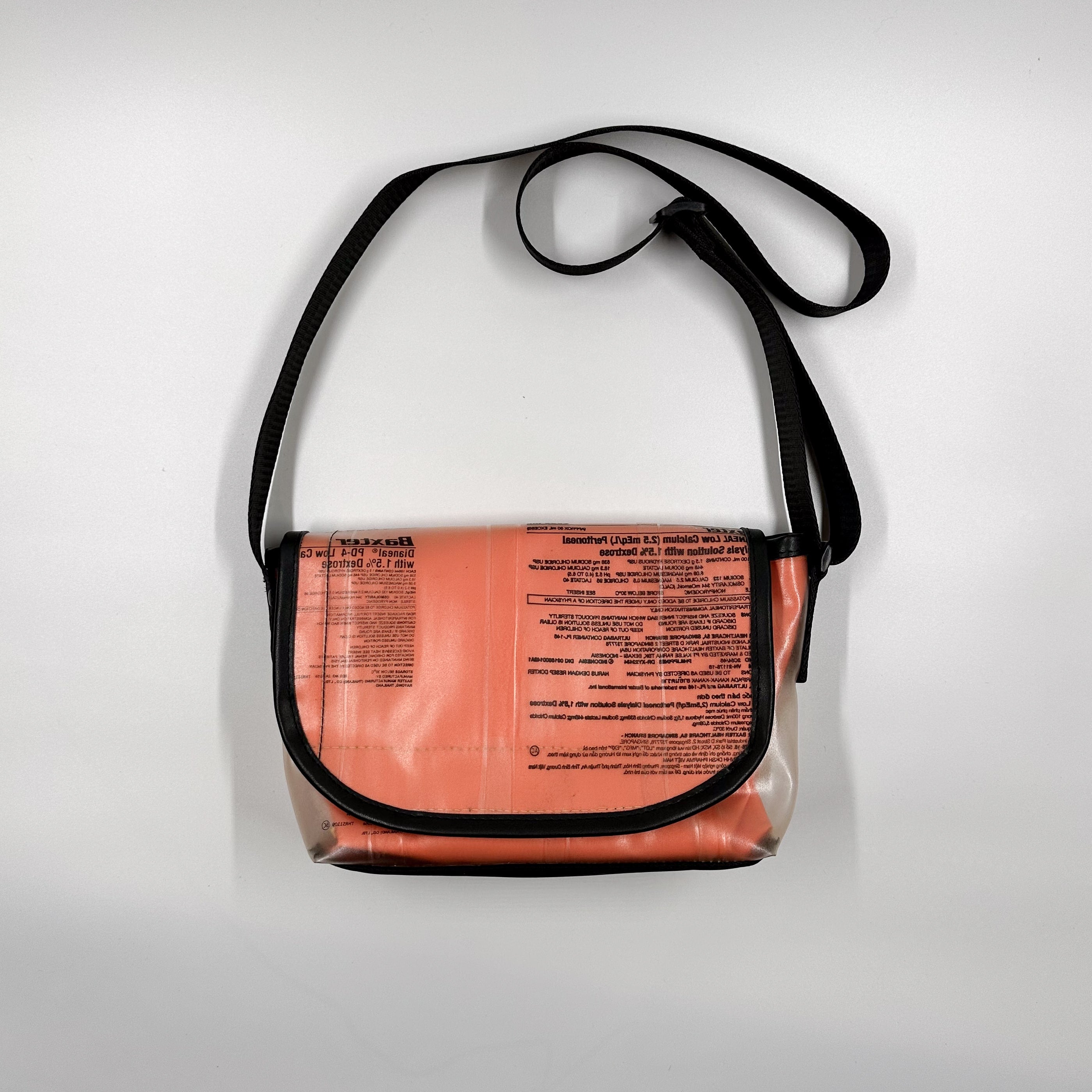 Handicraft sustainable and recycled accessory bag from Asia. The pouch is made of recycled dialysis bag and is sold online on www.qacrafts.com.