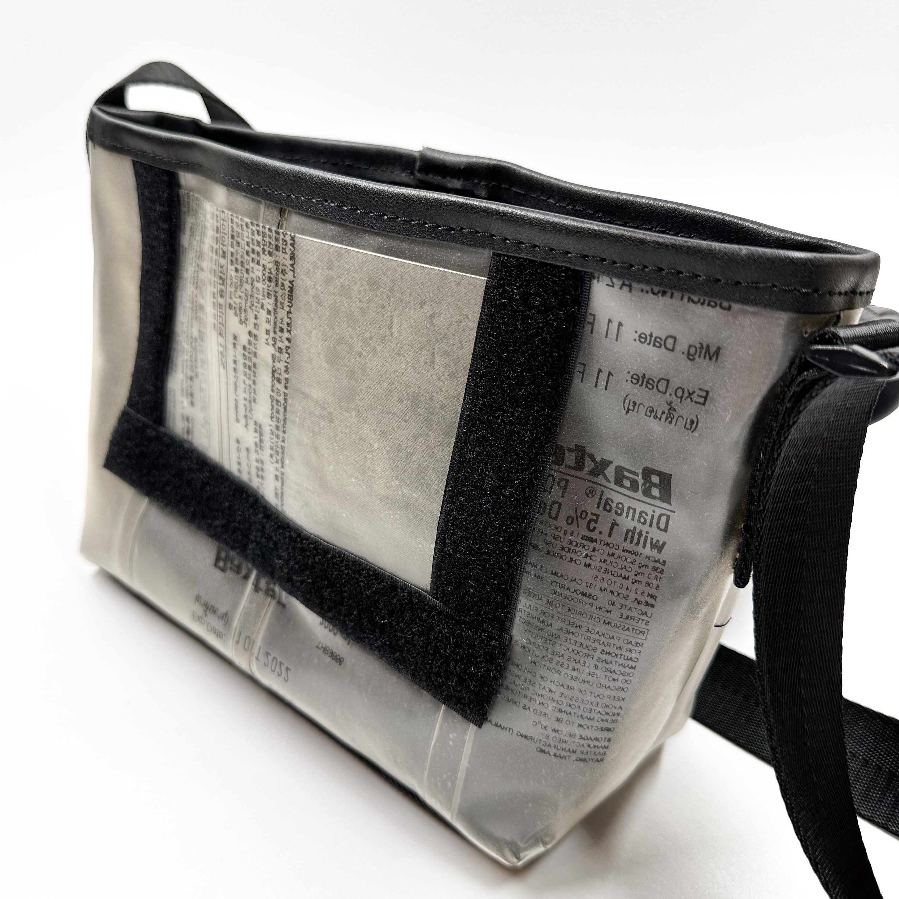 Handicraft sustainable and recycled accessory bag from Asia. The pouch is made of recycled dialysis bag and is sold online on www.qacrafts.com.