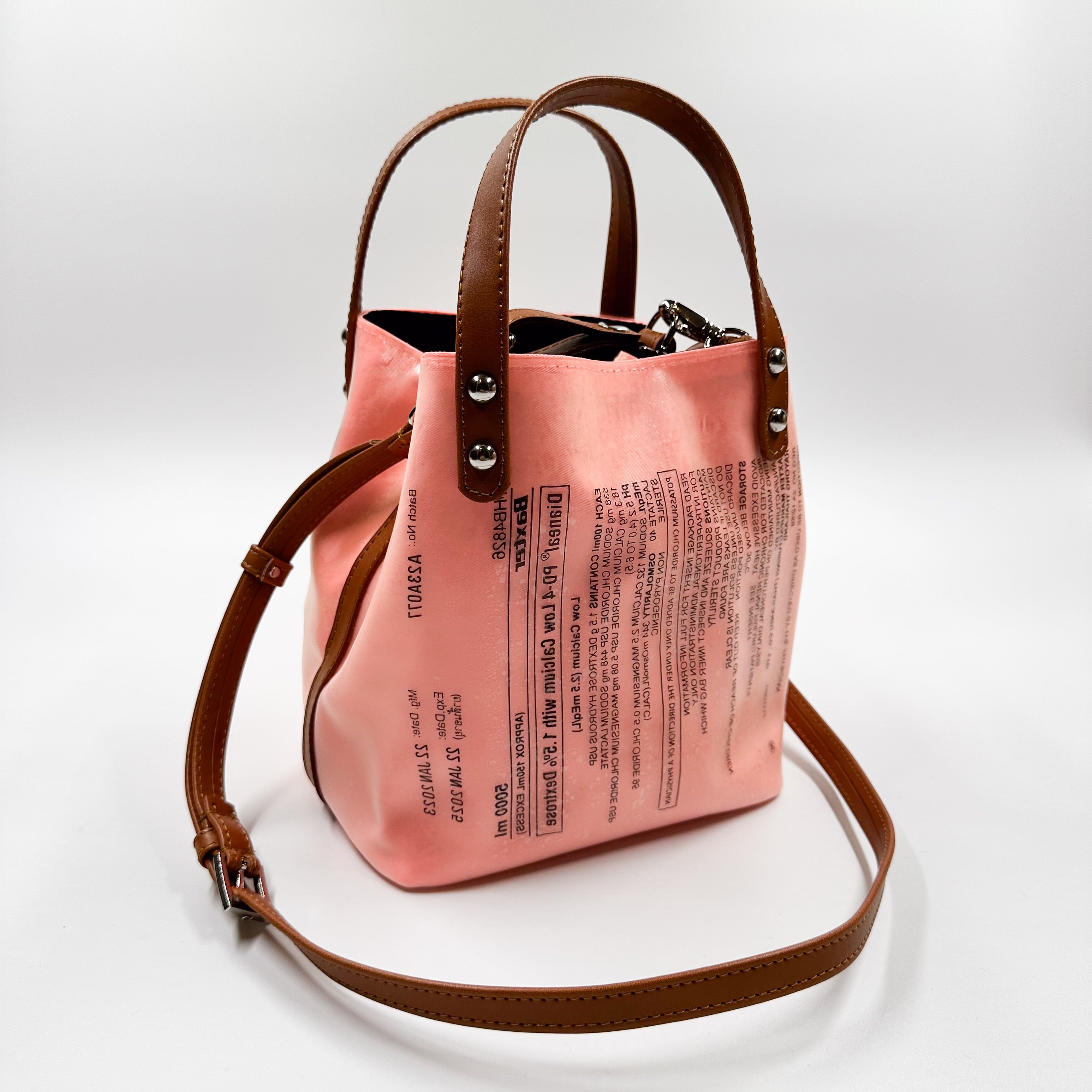 Handicraft sustainable and recycled accessory bag from Asia. The pouch is made of recycled dialysis bag and is sold online on www.qacrafts.com.