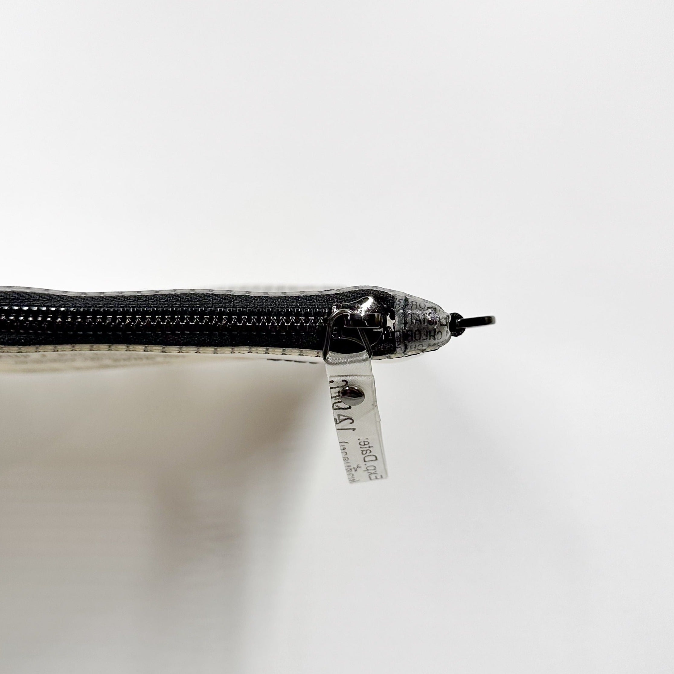 Handicraft sustainable and recycled bag from Asia. The pouch is made of recycled dialysis bag and is sold online on www.qacrafts.com.