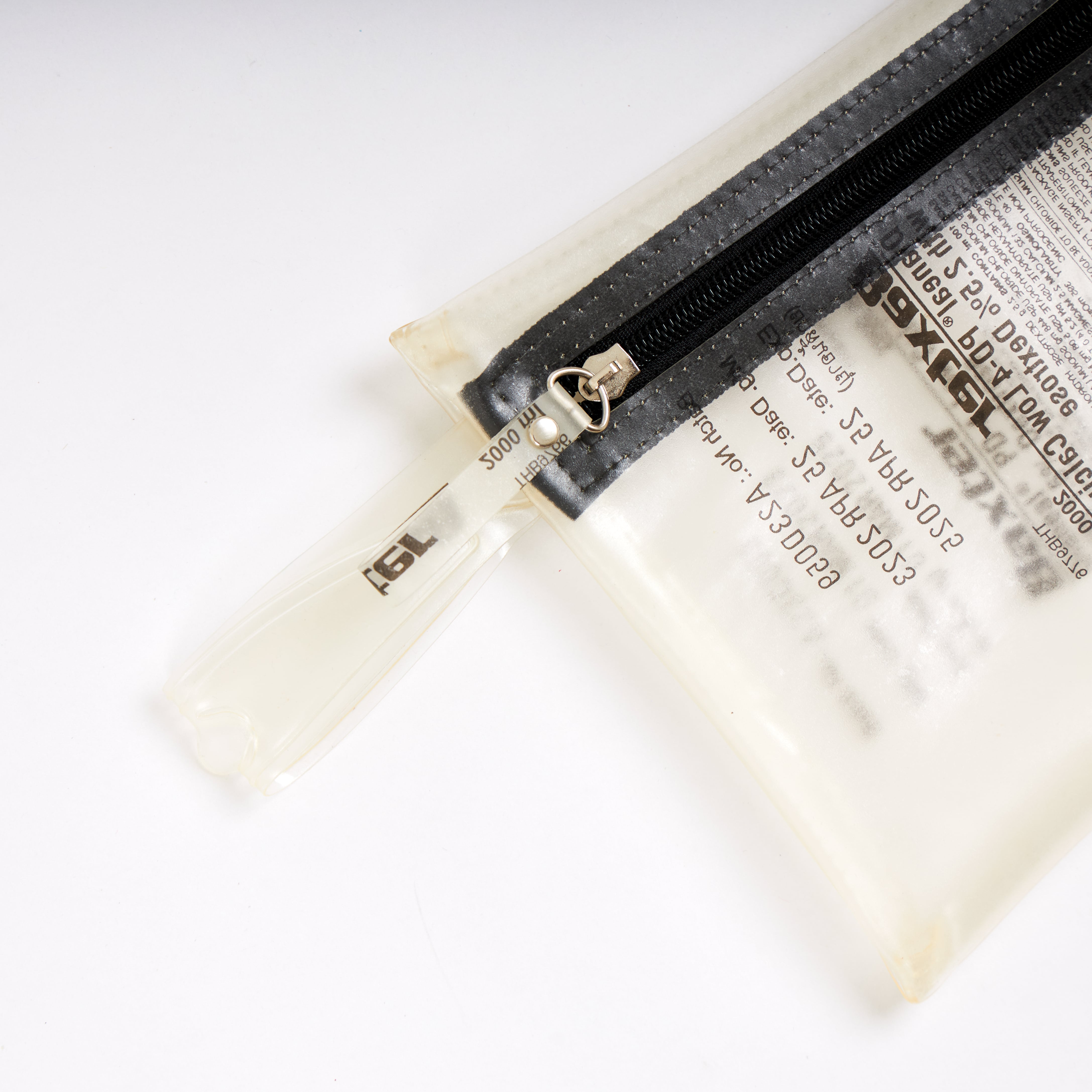 Sustainable handcraft and recycled pouch from Asia. The pouch is made of recycled dialysis bag and is sold online on www.qacrafts.com.