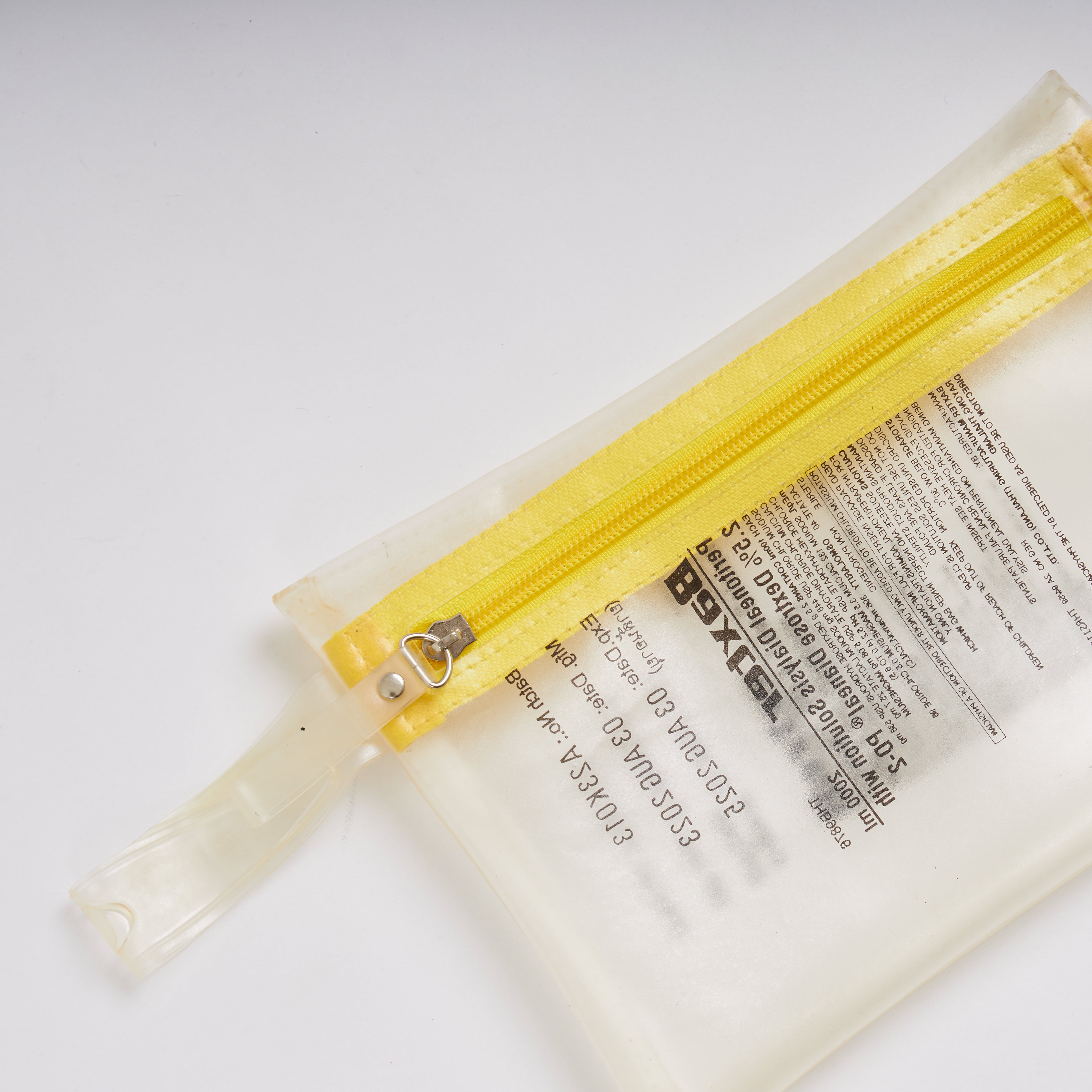 Sustainable handcraft and recycled pouch from Asia. The pouch is made of recycled dialysis bag and is sold online on www.qacrafts.com.