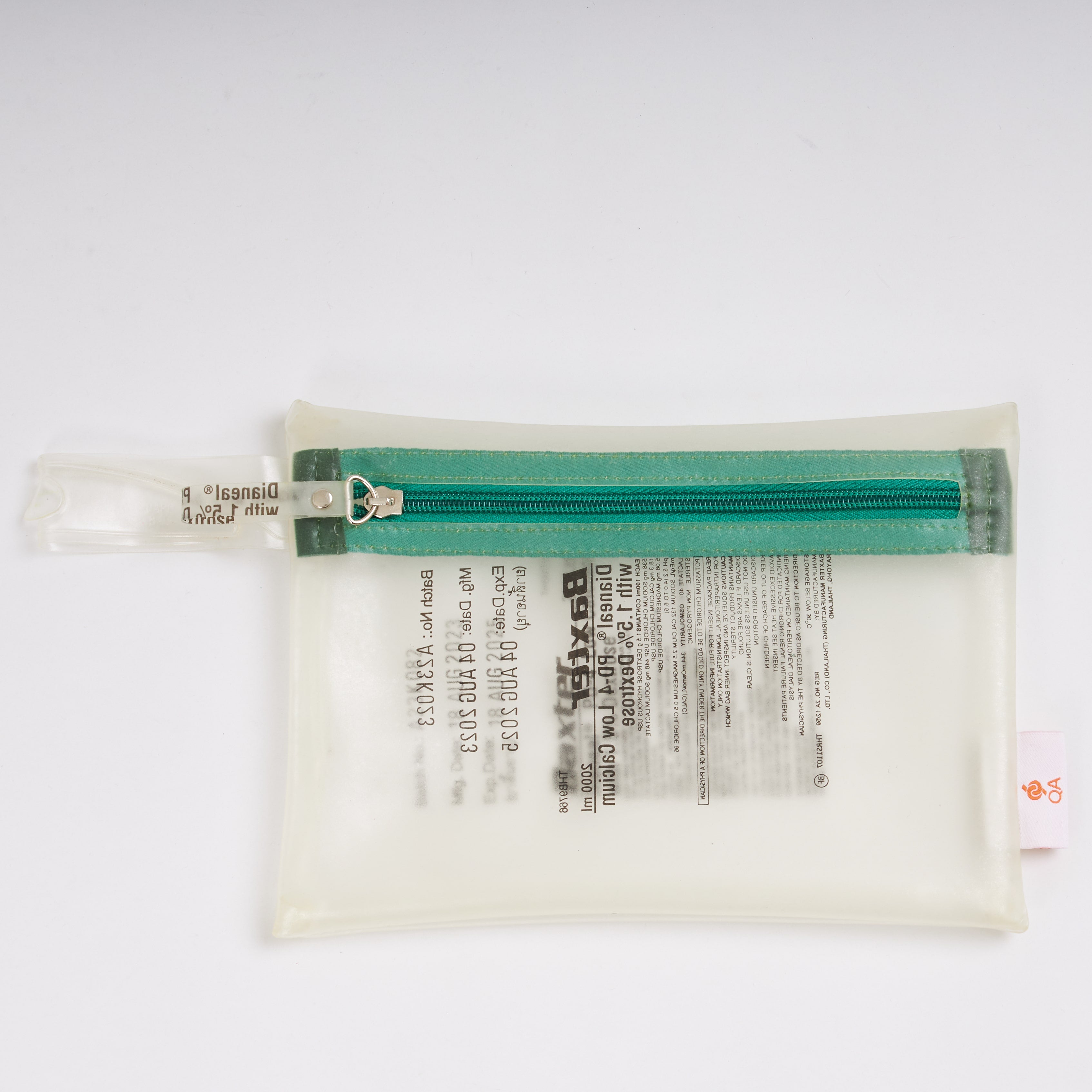 Sustainable handcraft and recycled pouch from Asia. The pouch is made of recycled dialysis bag and is sold online on www.qacrafts.com.