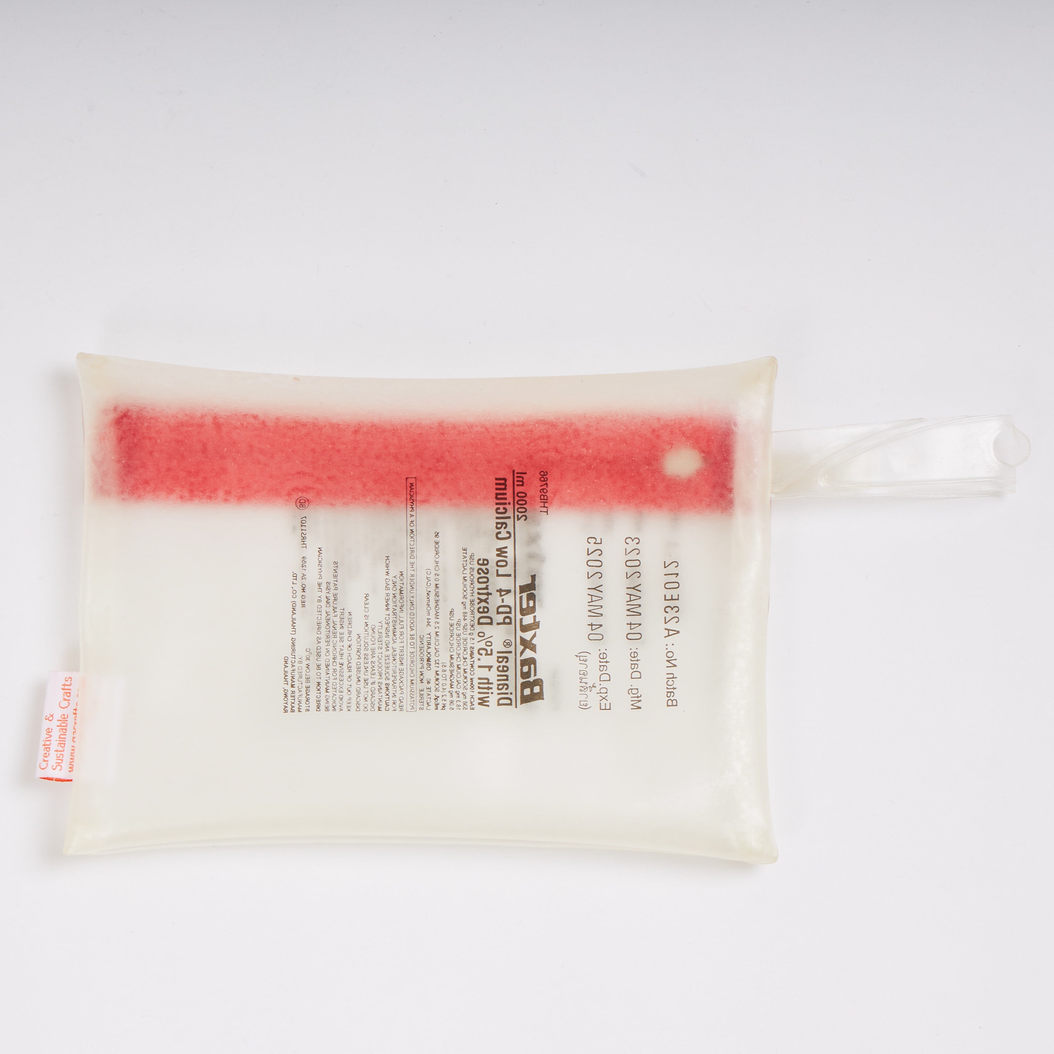 Sustainable handcraft and recycled pouch from Asia. The pouch is made of recycled dialysis bag and is sold online on www.qacrafts.com.