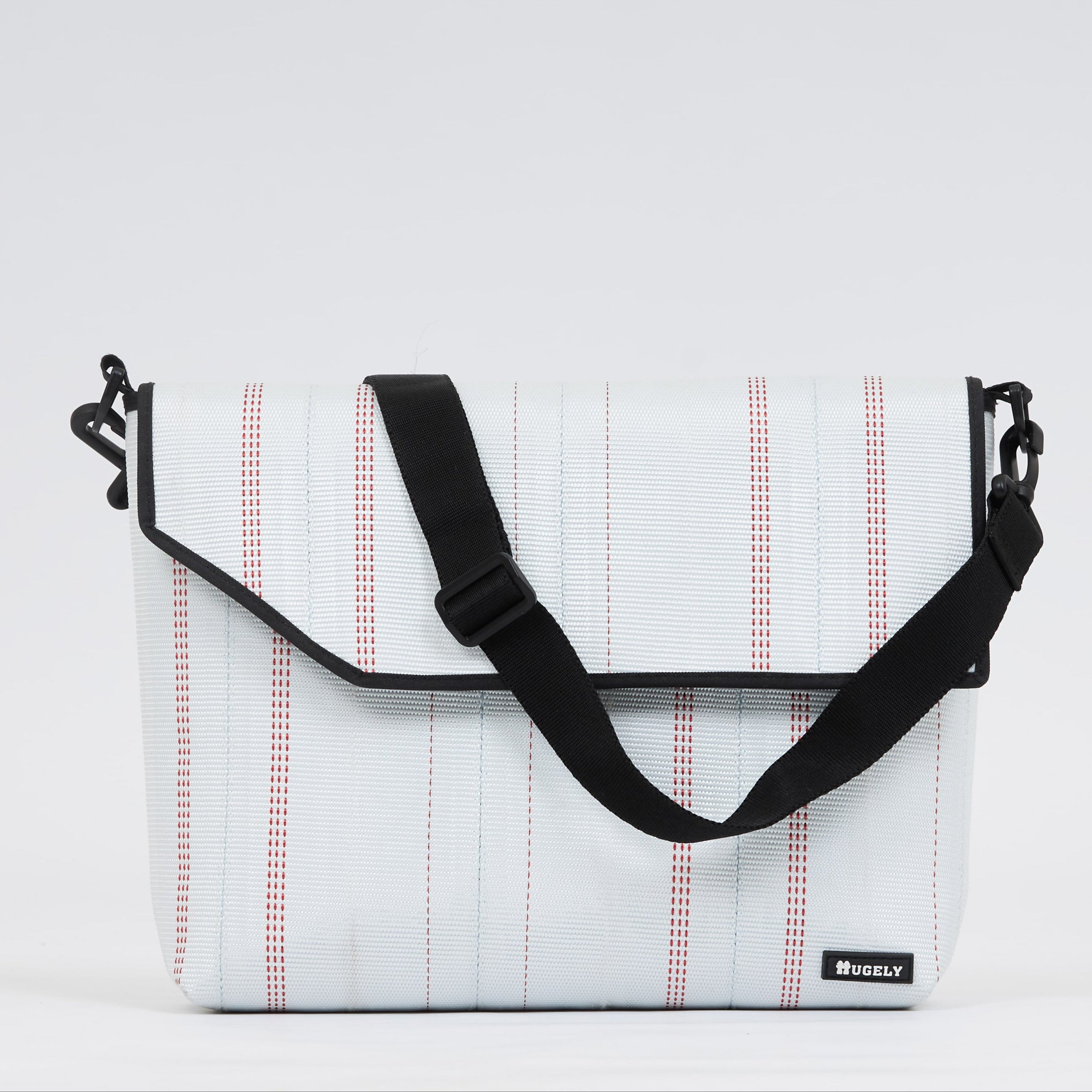 Upcycled firehose sold on www.qacrafts.com. Each piece is handmade, sustainable and water-resistant.