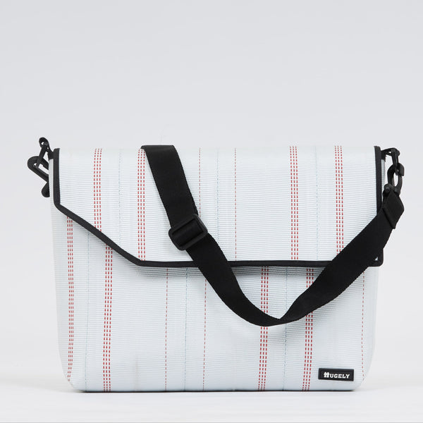 Upcycled firehose sold on www.qacrafts.com. Each piece is handmade, sustainable and water-resistant.