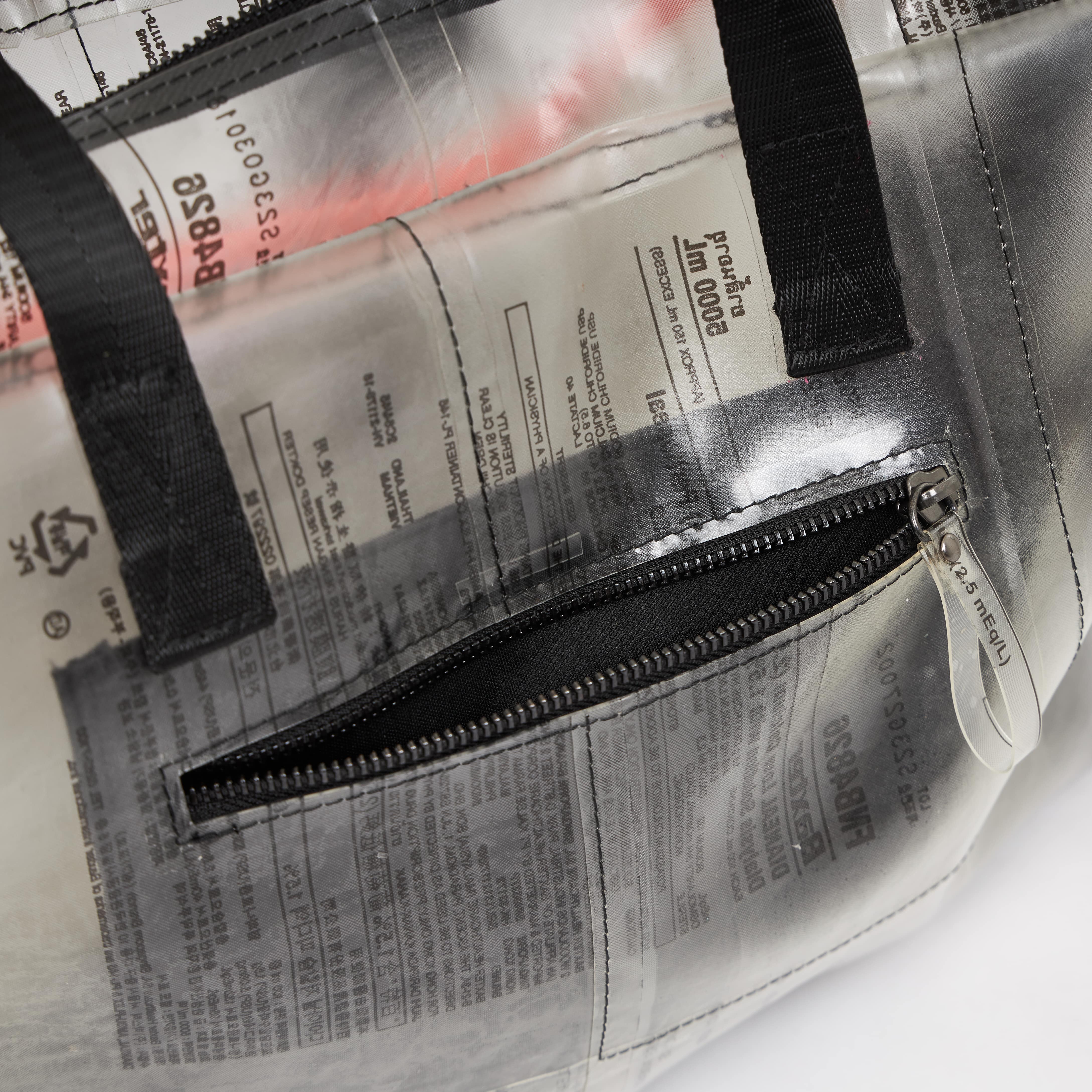 Handmade of recycled dialysis bags, it's a sustainable craft and ecofriendly. Sold by www.qacrafts.com