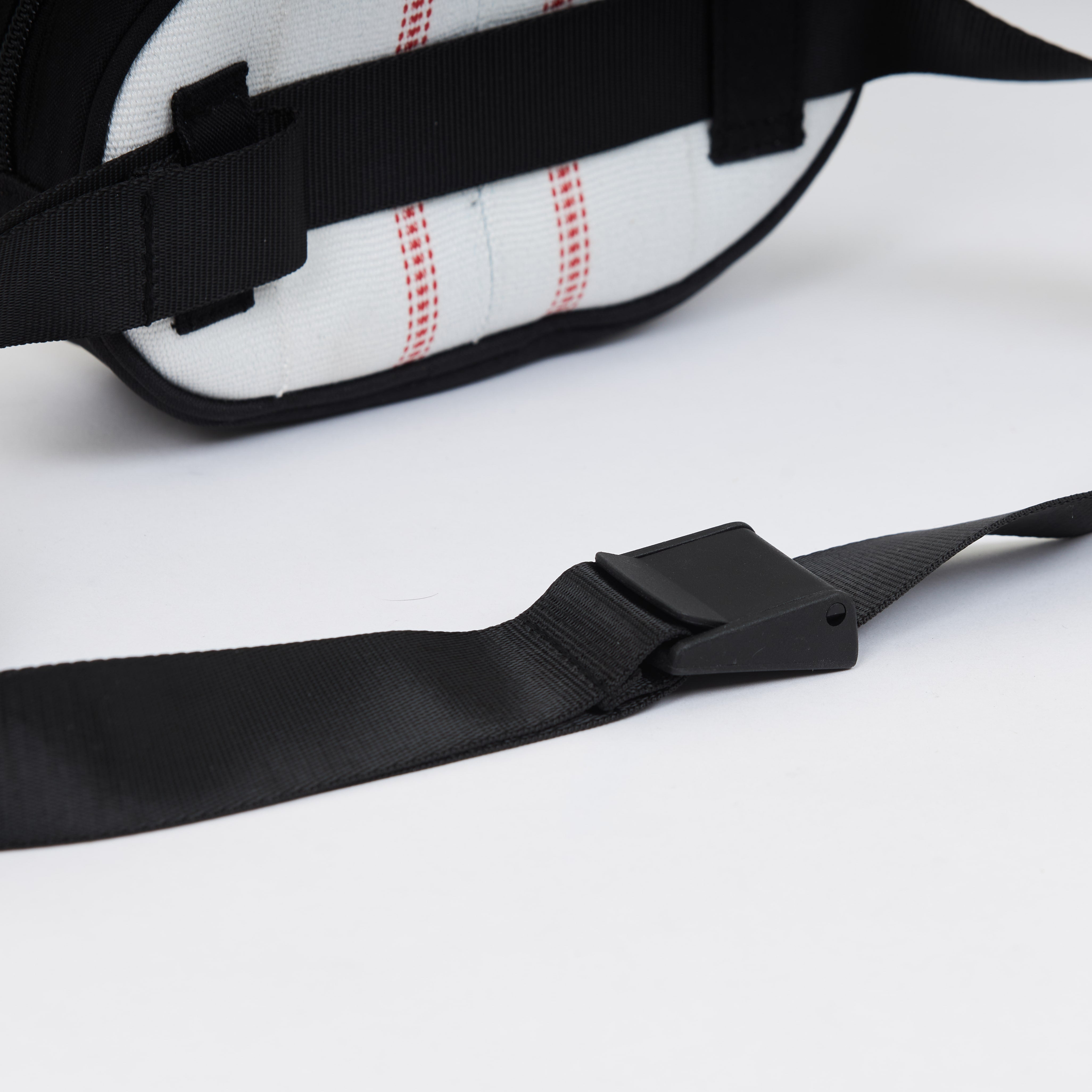 Handmade sustainable and recycled bag from Asia. The cross body bag is made of recycled firehose and sold online on www.qacrafts.com.