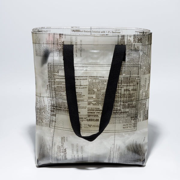 Handicraft sustainable and recycled tote bag from Asia. The bag is made of recycled dialysis bag and is sold online on www.qacrafts.com.