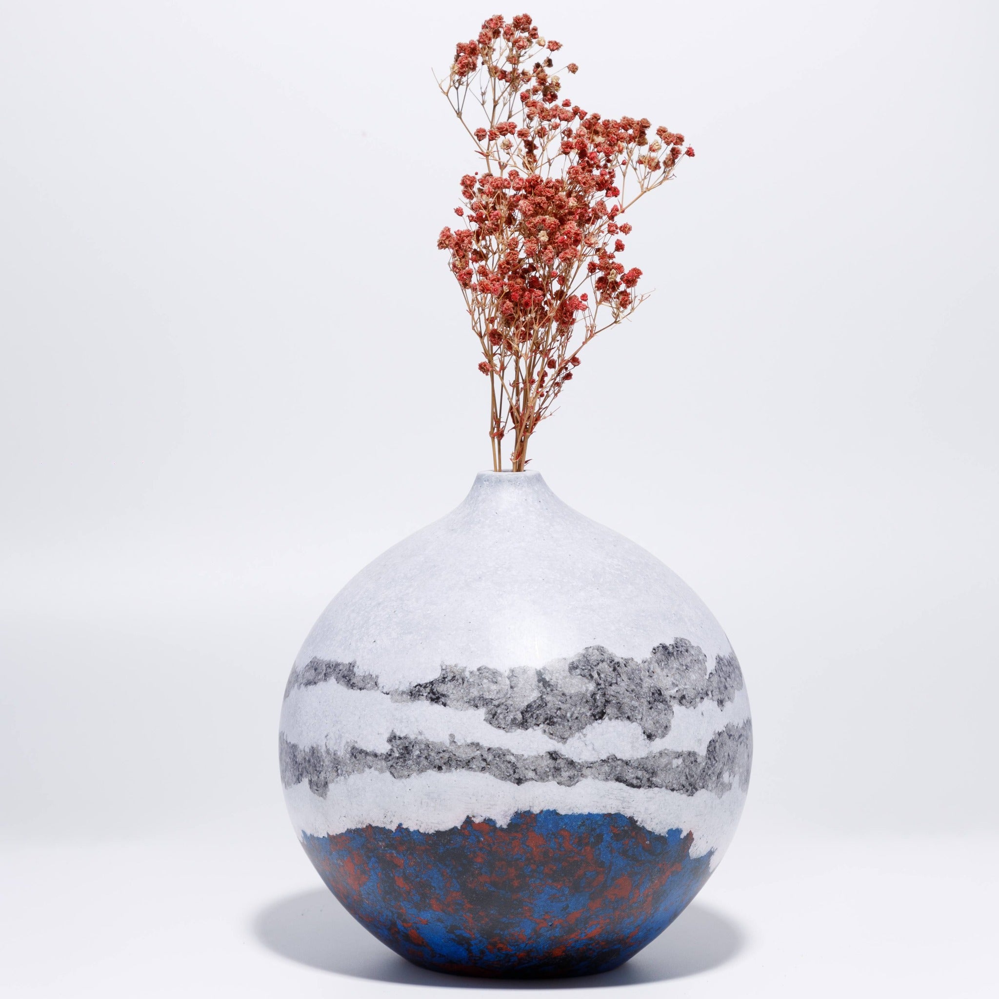 Handicraft sustainable and recycled decorative vase from Asia. The home decor vase is made of recycled paper and is sold online on www.qacrafts.com.