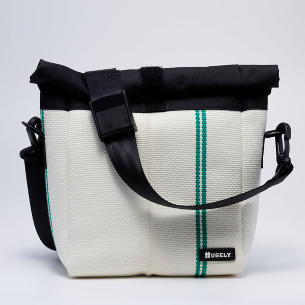 Handicraft sustainable and recycled bag from Asia. The crossbody bag is made of recycled firehose and sold online on www.qacrafts.com.