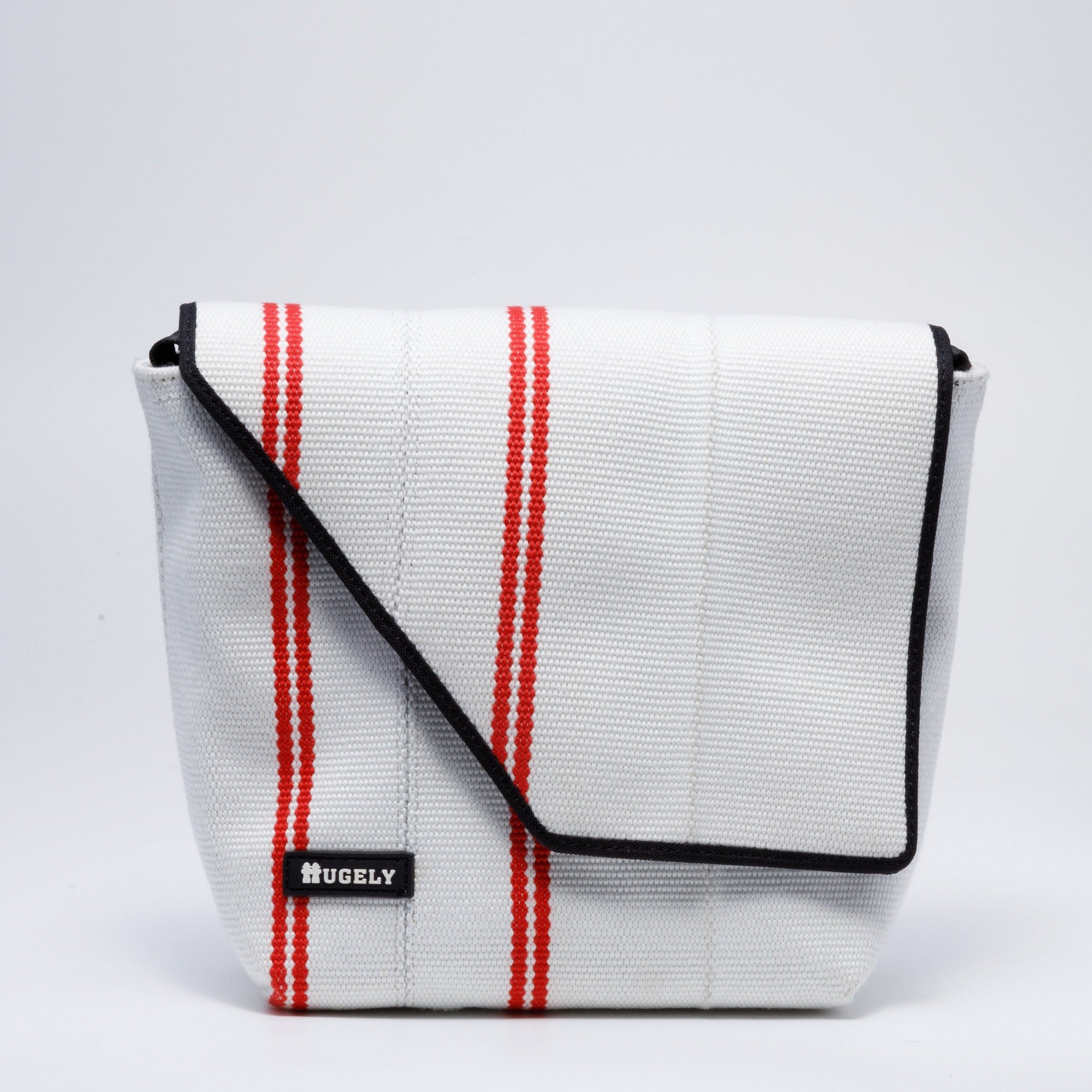 Handcraft sustainable and recycled bag from Asia. The cross body bag is made of recycled fire hose and sold online on www.qacrafts.com.