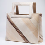 Handicraft sustainable and natural handbag from Asia. The handbag is made of natural, vegan and toxic-free banana tree and sold online on www.qacrafts.com.
