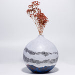 Handicraft sustainable and recycled decorative vase from Asia. The home decor vase is made of recycled paper and is sold online on www.qacrafts.com.