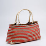 Handicraft sustainable and natural handbag from Asia. The handbag is made of natural, vegan and toxic-free bamboo and sold online on www.qacrafts.com.